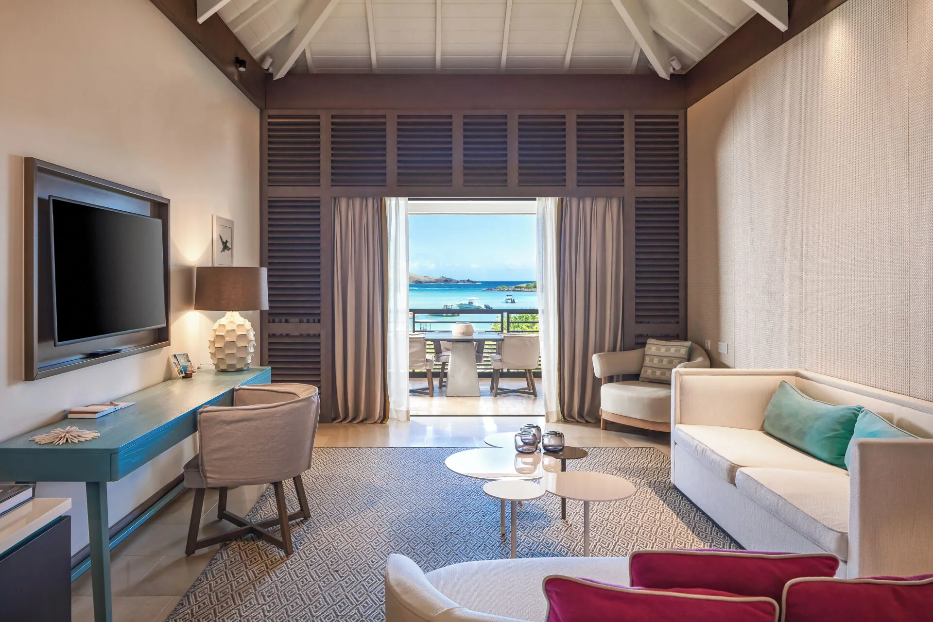 Ocean Signature Suite lounge with terrace view at Le Barthélemy Hotel & Spa.