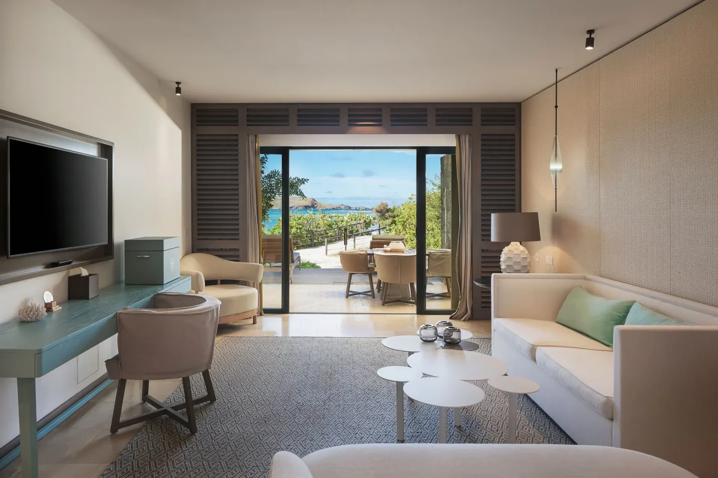 La Suite Signature Plage living area with ocean view at Le Barthélemy Hotel & Spa.