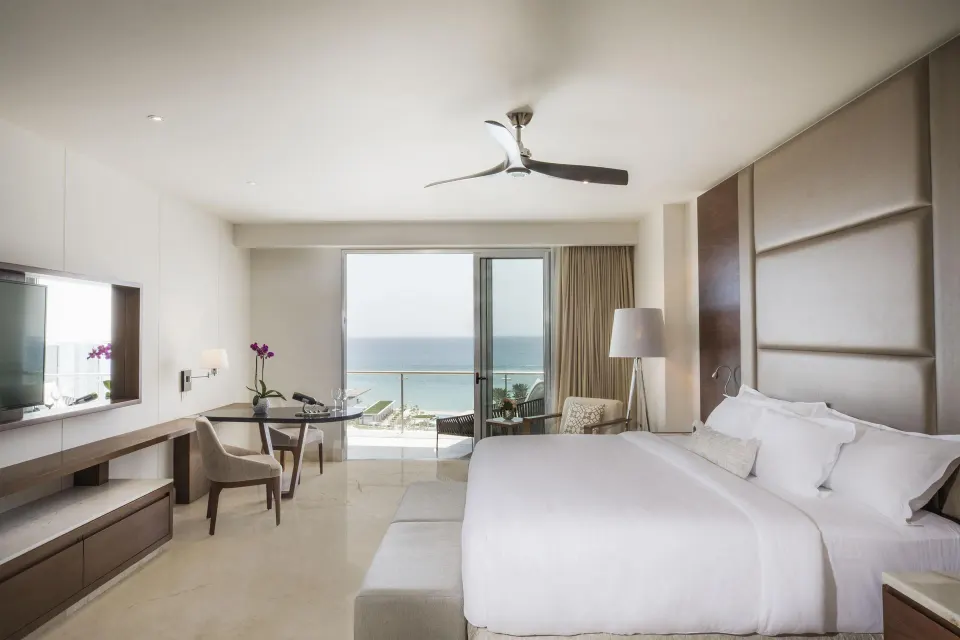 Royale Governor Partial Ocean View king bedroom at Le Blanc Spa Resort Los Cabos with balcony and sea view.