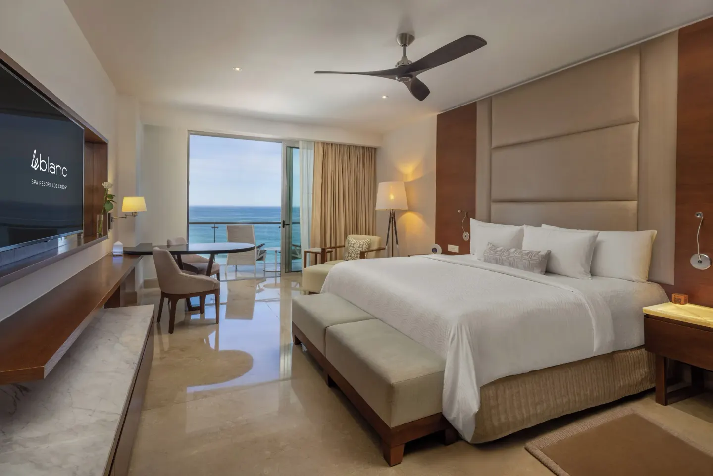 Royale Honeymoon Ocean View king room at Le Blanc Spa Resort Los Cabos with bed and open balcony.