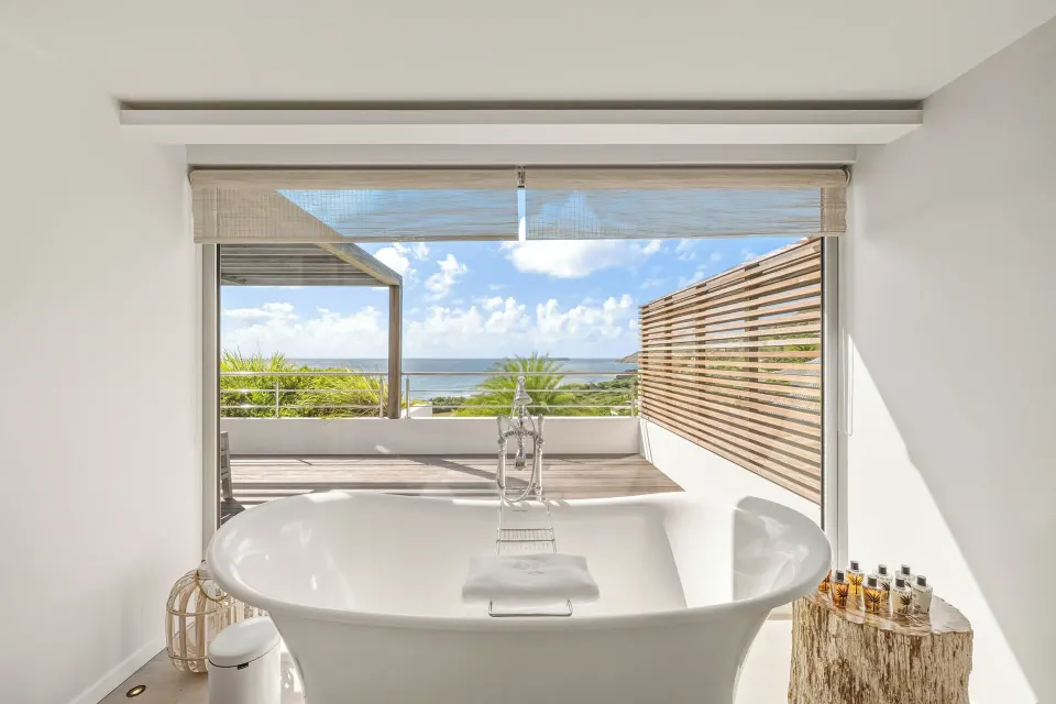 Freestanding tub facing the ocean in a Duplex Spirit Suite at Le Toiny Hôtel & Beach Club.