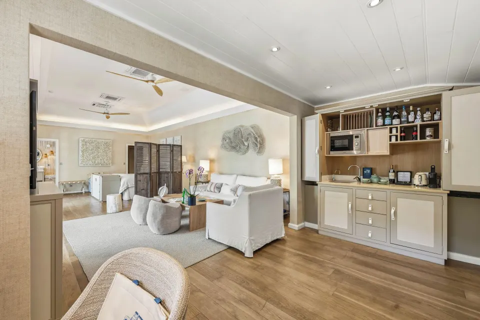 Junior Suite living area with kitchenette and bedroom beyond at Le Toiny Hôtel & Beach Club.