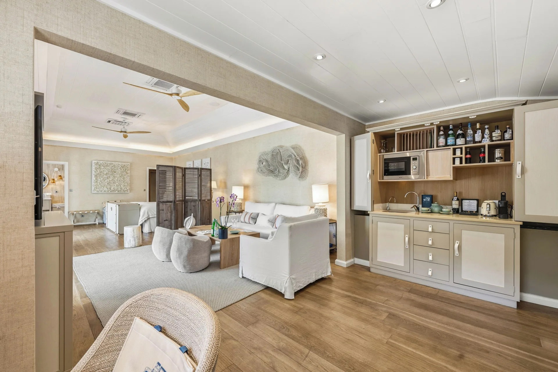 Junior Suite living area with kitchenette and bedroom beyond at Le Toiny Hôtel & Beach Club.