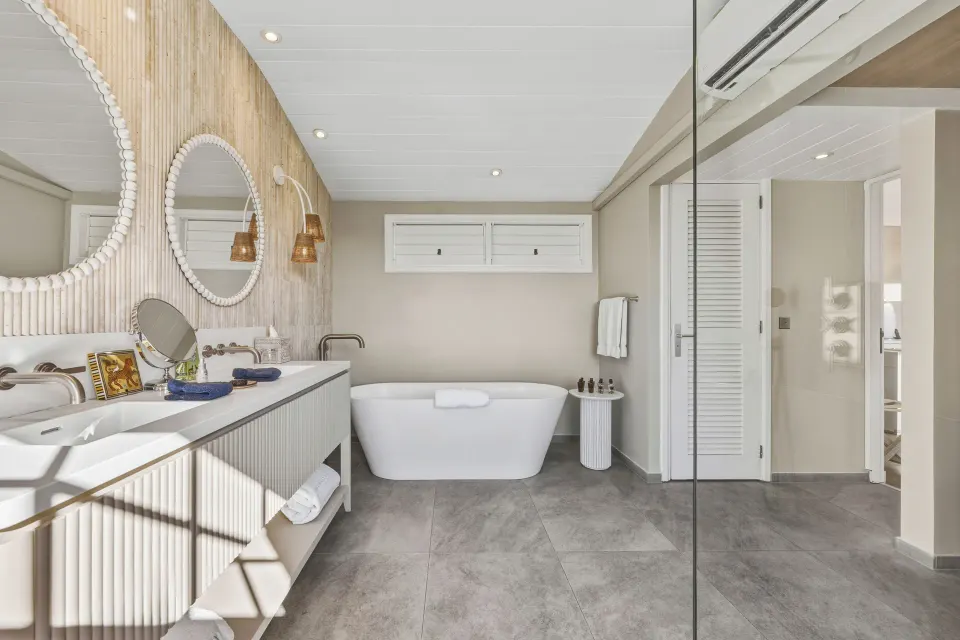 Signature Suite bathroom vanity and freestanding tub at Le Toiny Hôtel & Beach Club.