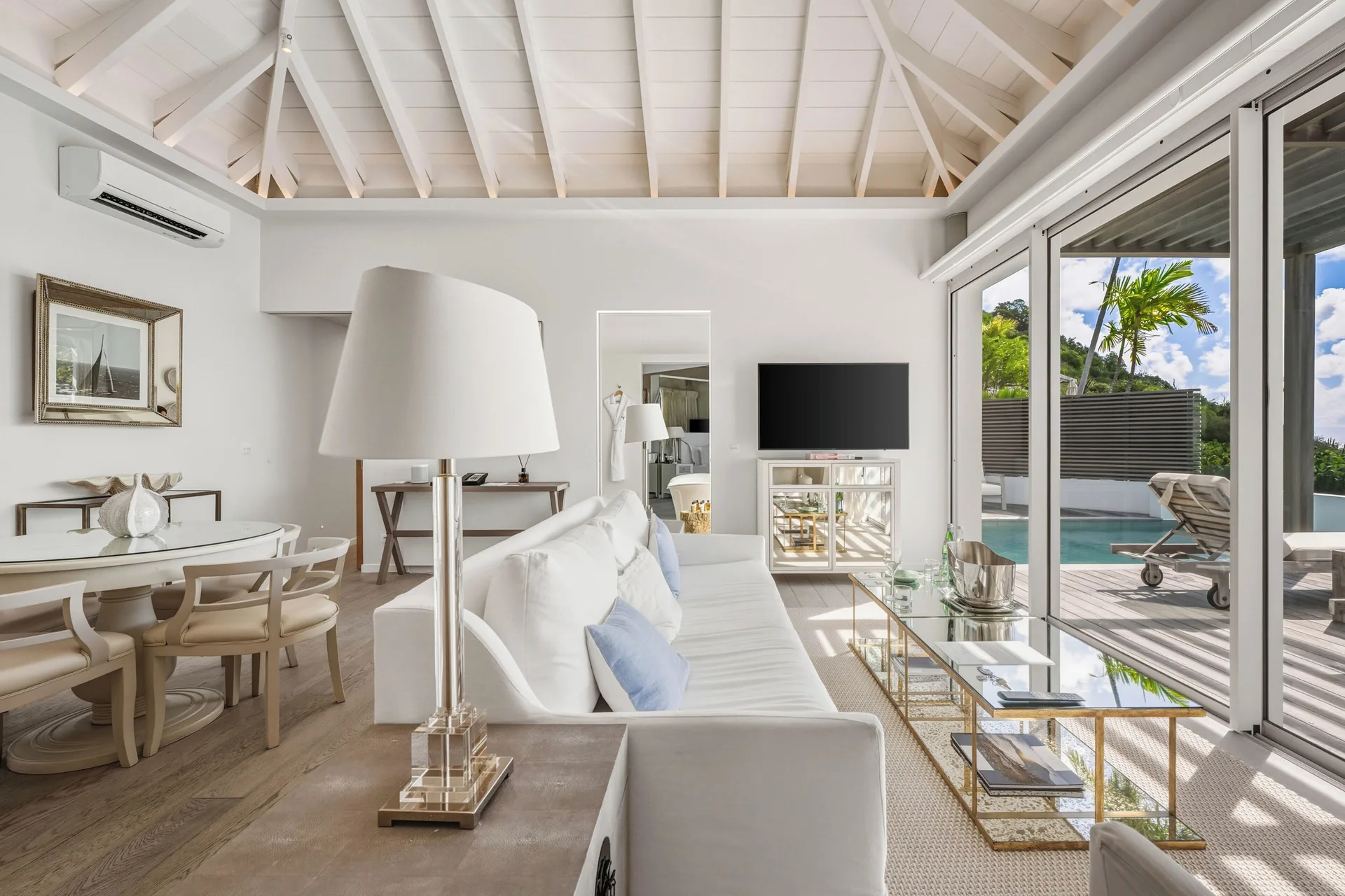 Spirit Suite living area with sofa, dining table, and private pool at Le Toiny Hôtel & Beach Club.