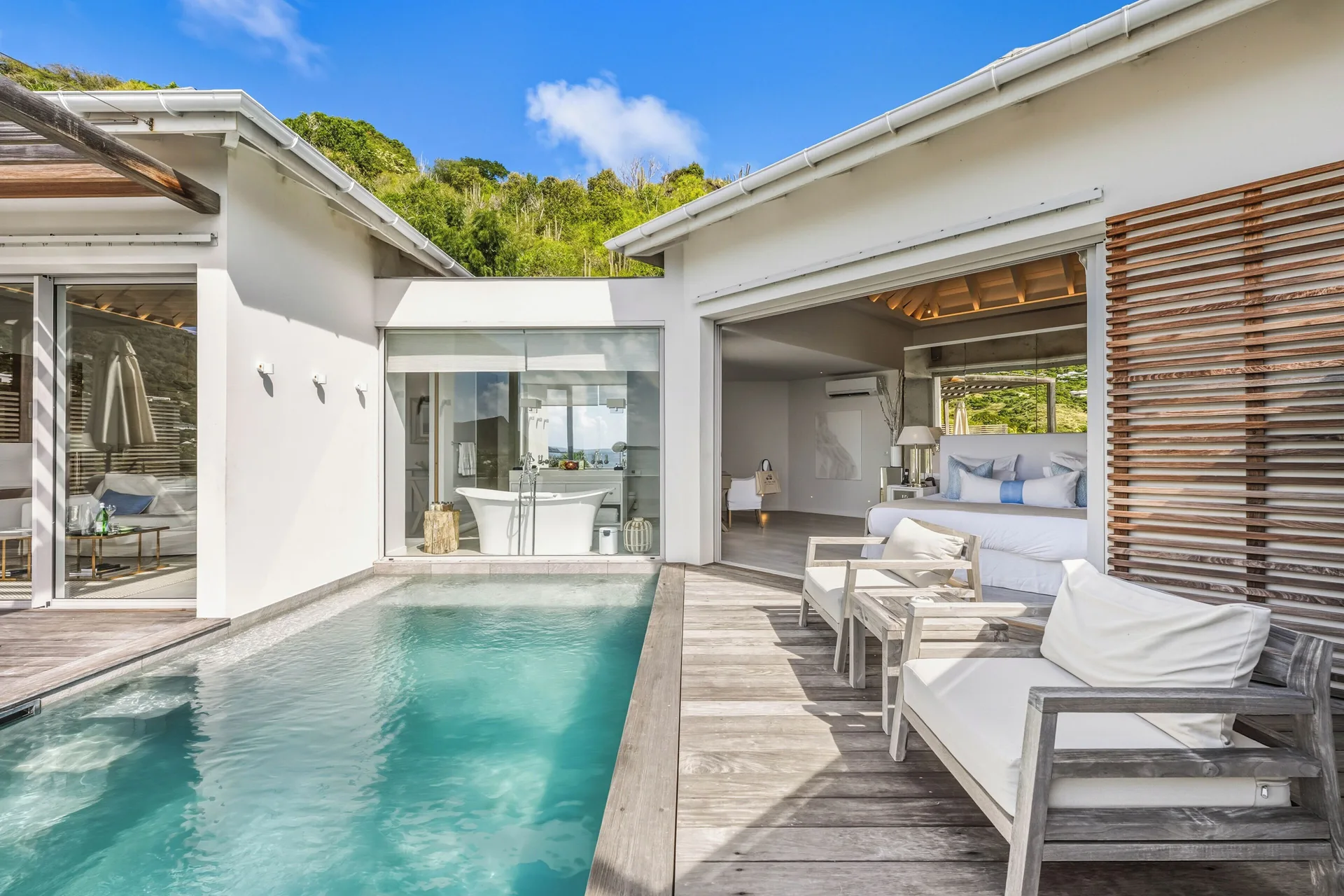 Spirit Suite private pool deck and king bed at Le Toiny Hôtel & Beach Club.