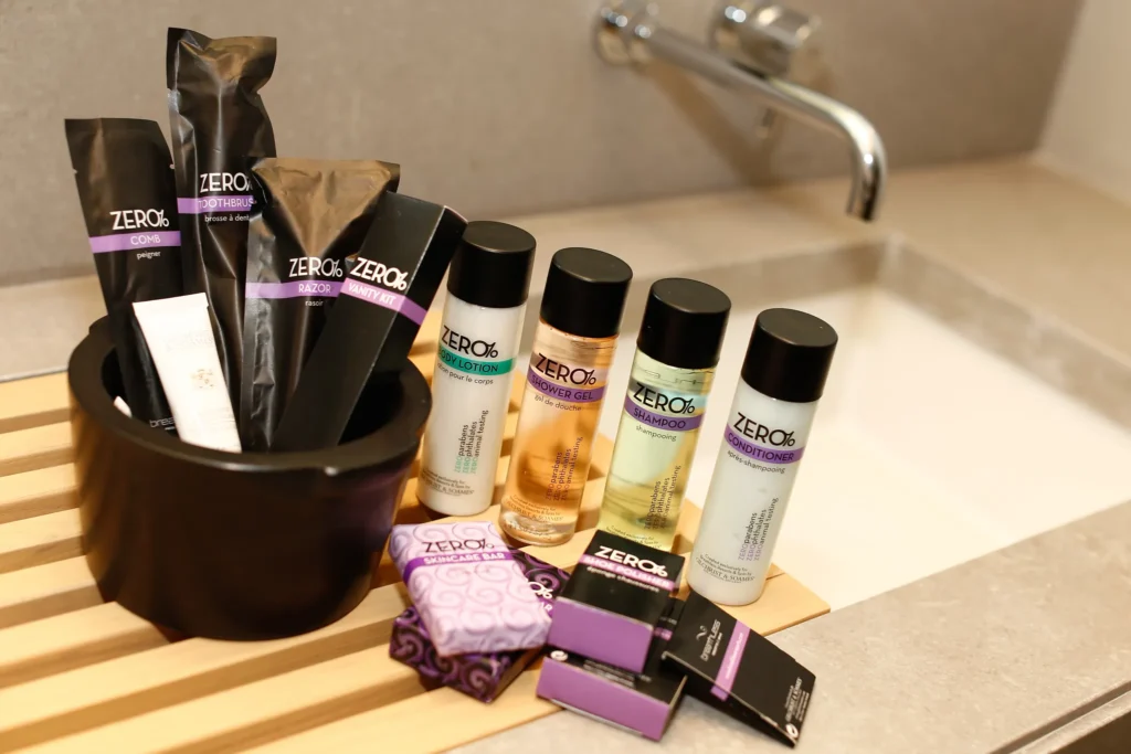 Luxury Zero% bath amenities displayed in the Allure Suite Marina View bathroom at Breathless Cabo San Lucas.