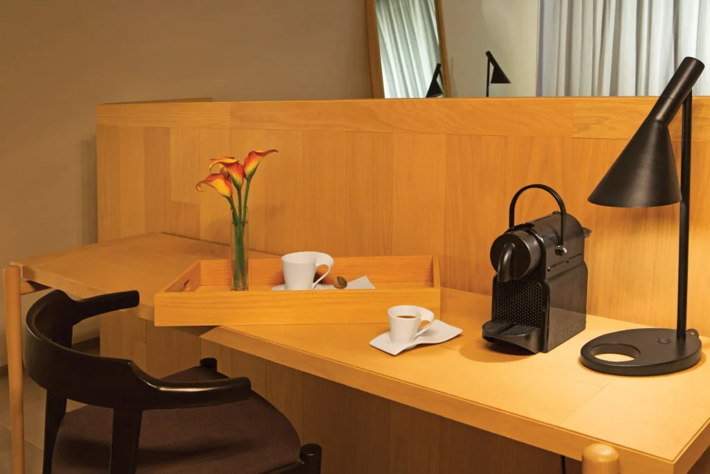 In-suite work desk and Nespresso coffee station in the Allure Suite Marina View at Breathless Cabo San Lucas.