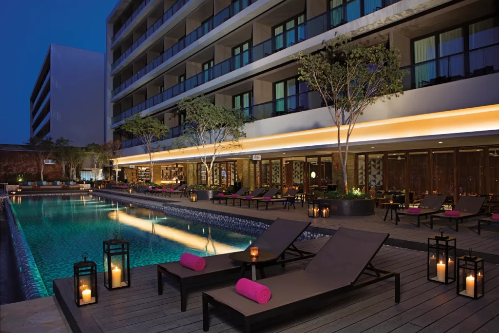 Luxury Freestyle Pool at night with glowing lanterns at Breathless Cabo San Lucas