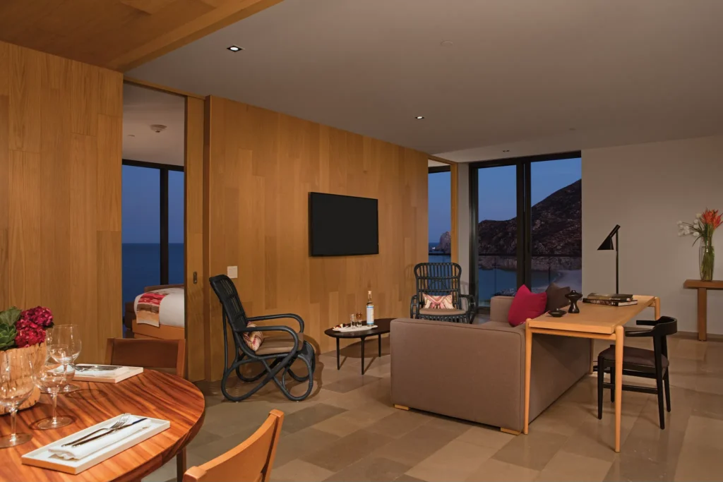 Contemporary living room with ocean views in the Xhale Club Master One Bedroom Suite at Breathless Cabo San Lucas.