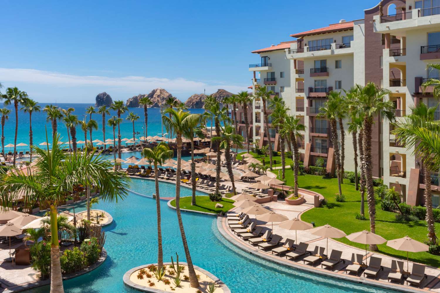 Villa del Arco Beach Resort & Spa with scenic pool overlooking Land’s End and Medano Beach.