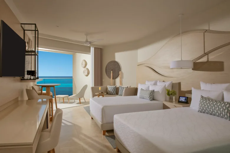 Allure Junior Suite Partial Ocean View with double beds at Breathless Cancun Soul Resort and partial Caribbean Sea views.