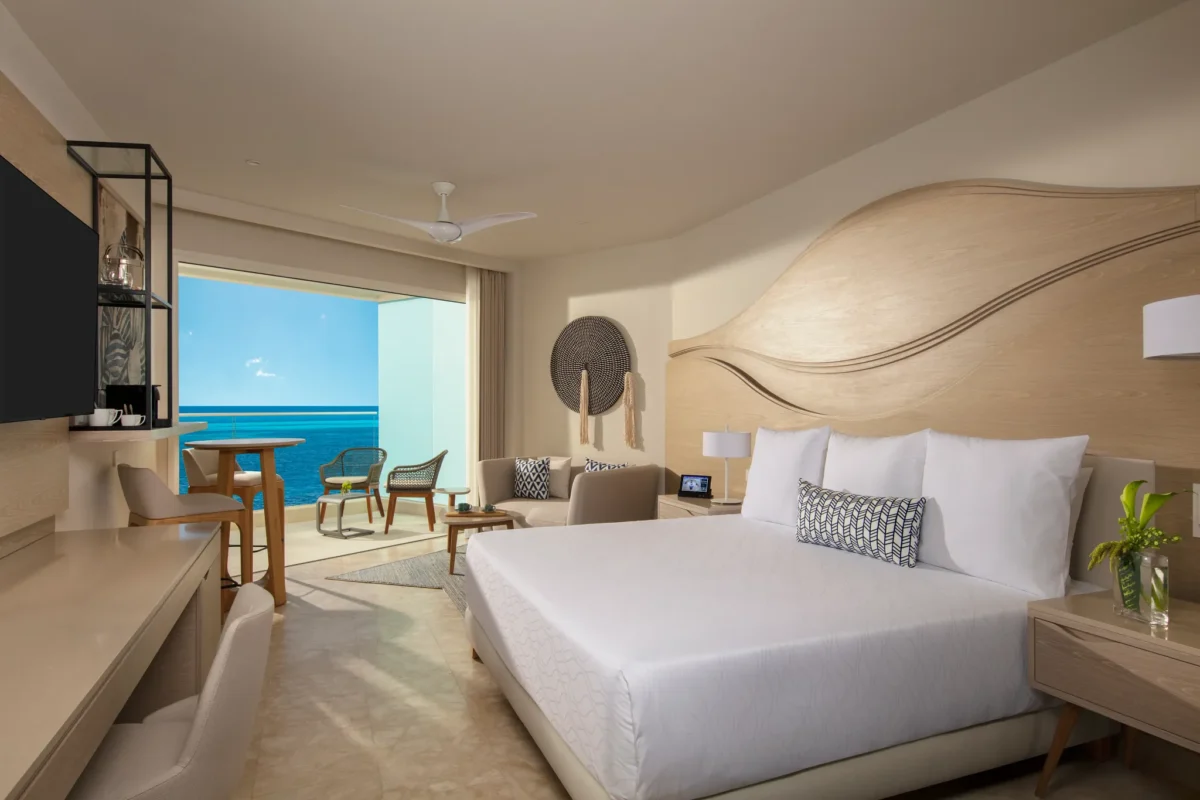 Xcelerate Junior Suite Ocean View with king bed at Breathless Cancun Soul Resort overlooking the Caribbean Sea.
