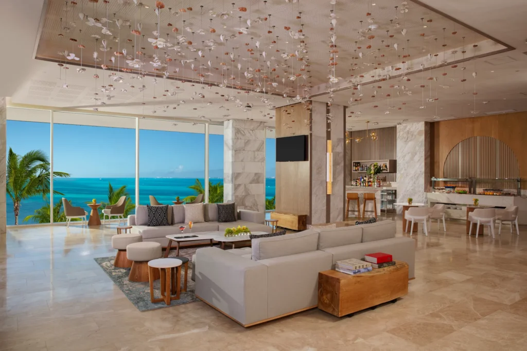 Xhale Club Lounge at Breathless Cancun Soul featuring modern seating, ocean views, and exclusive guest access.