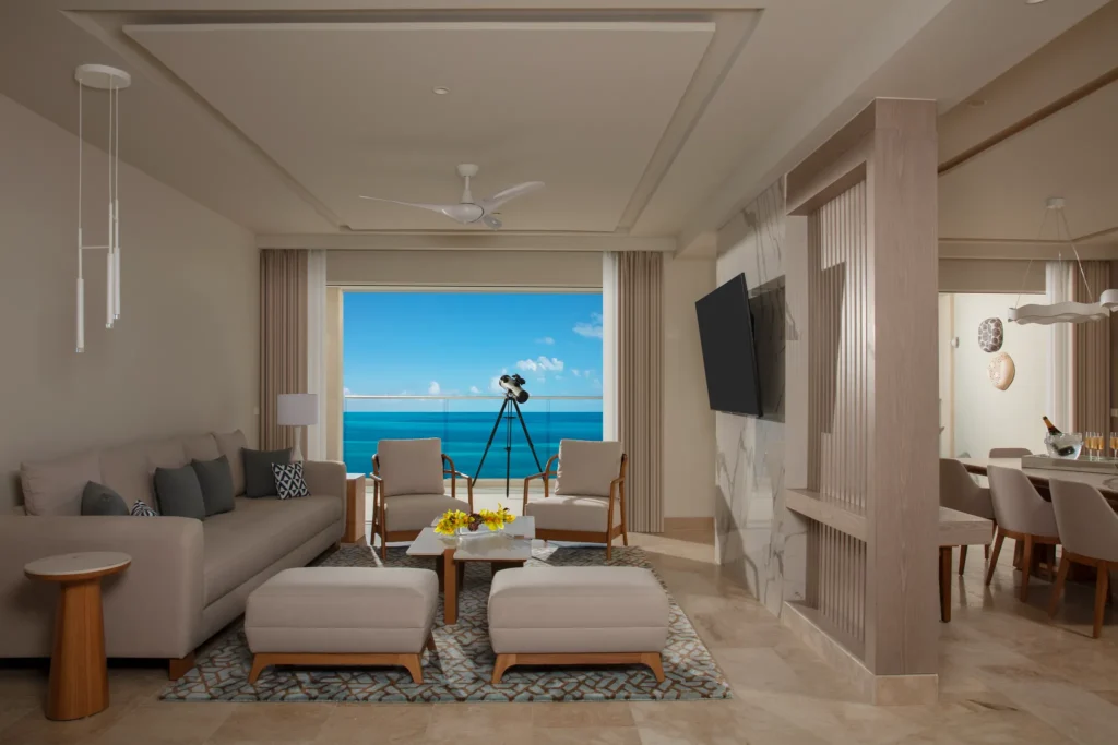 Spacious living area in the Xhale Club Presidential Suite Ocean Front at Breathless Cancun Soul Resort with ocean views and modern seating.
