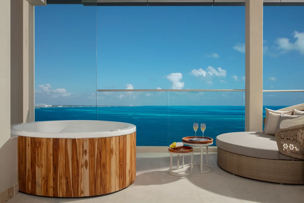 Private ocean-front terrace with whirlpool in the Xhale Club Presidential Suite at Breathless Cancun Soul Resort overlooking the Caribbean Sea.