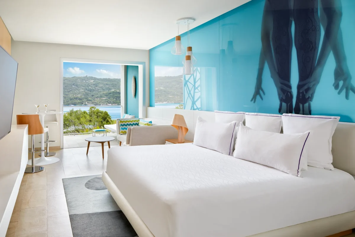 Allure Junior Suite Tropical View king room at Breathless Montego Bay with modern décor and balcony overlooking tropical gardens.