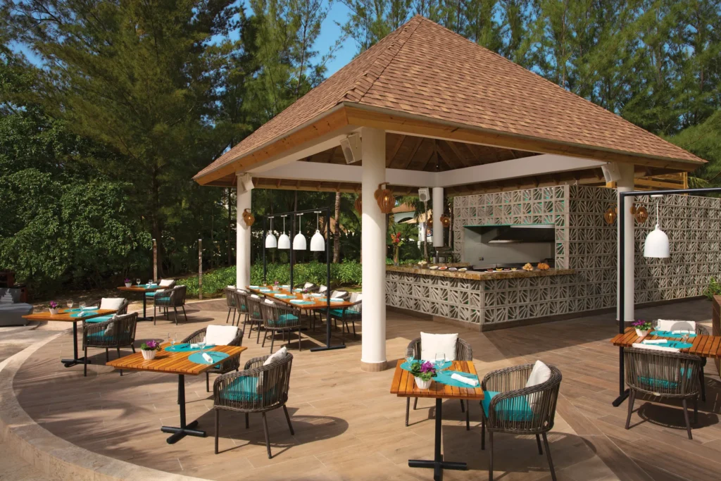Outdoor dining at Bare Buns Grill at Breathless Montego Bay, offering casual Caribbean bites.