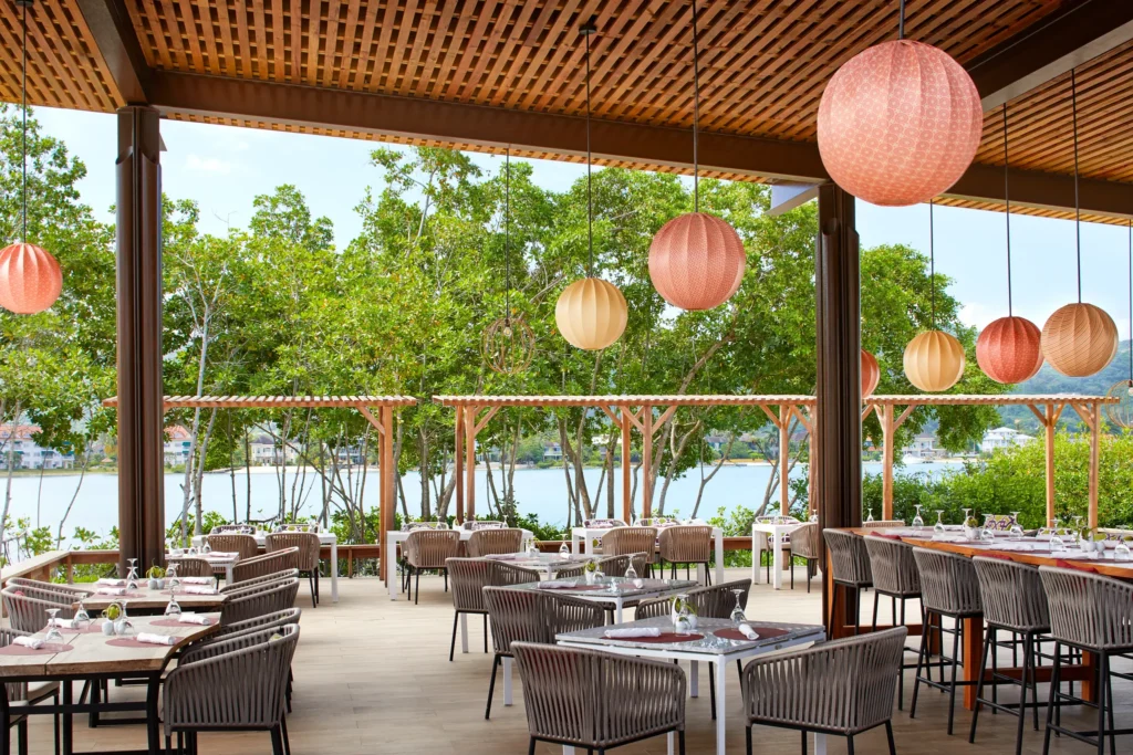 Seaside outdoor dining tables at Fish Nets Restaurant with views of Montego Bay.