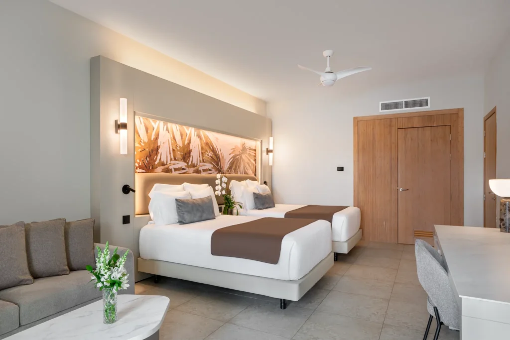Allure Junior Suite with double beds and private terrace with hot tub at Breathless Punta Cana Resort.