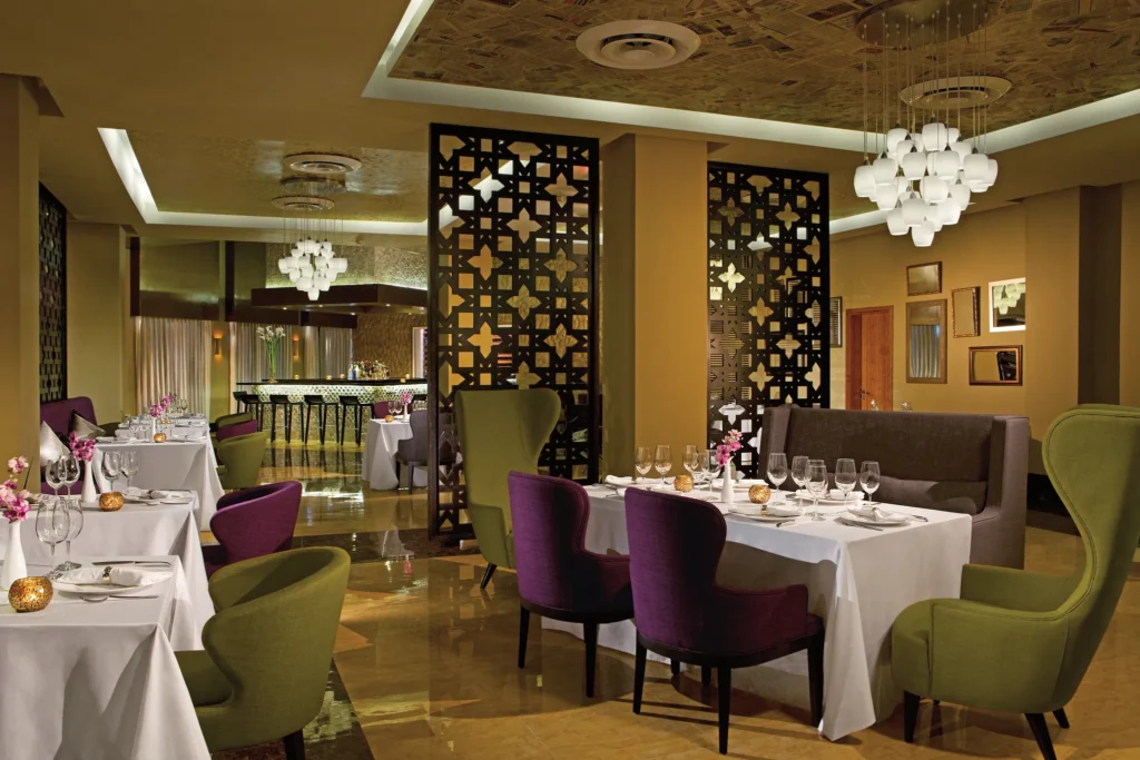 Coquette French restaurant at Breathless Punta Cana featuring elegant table settings, modern décor, and a refined upscale dining atmosphere.