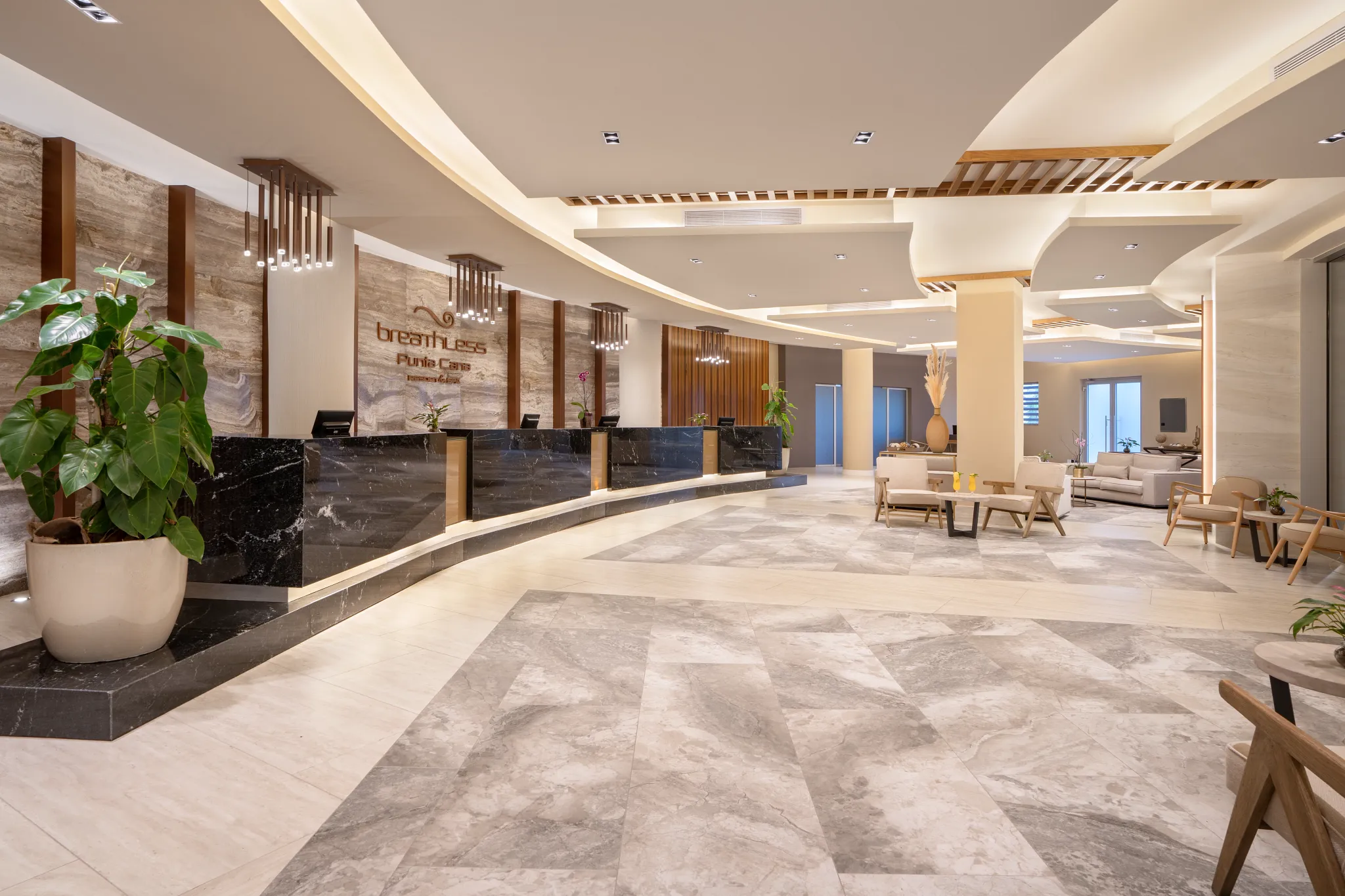 Spacious modern lobby at Breathless Punta Cana Resort with contemporary décor and seating areas.