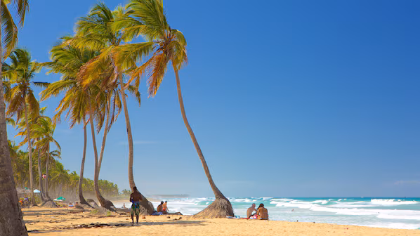 Macao Beach near Breathless Punta Cana with golden sand, rolling waves, and dramatic Caribbean coastline