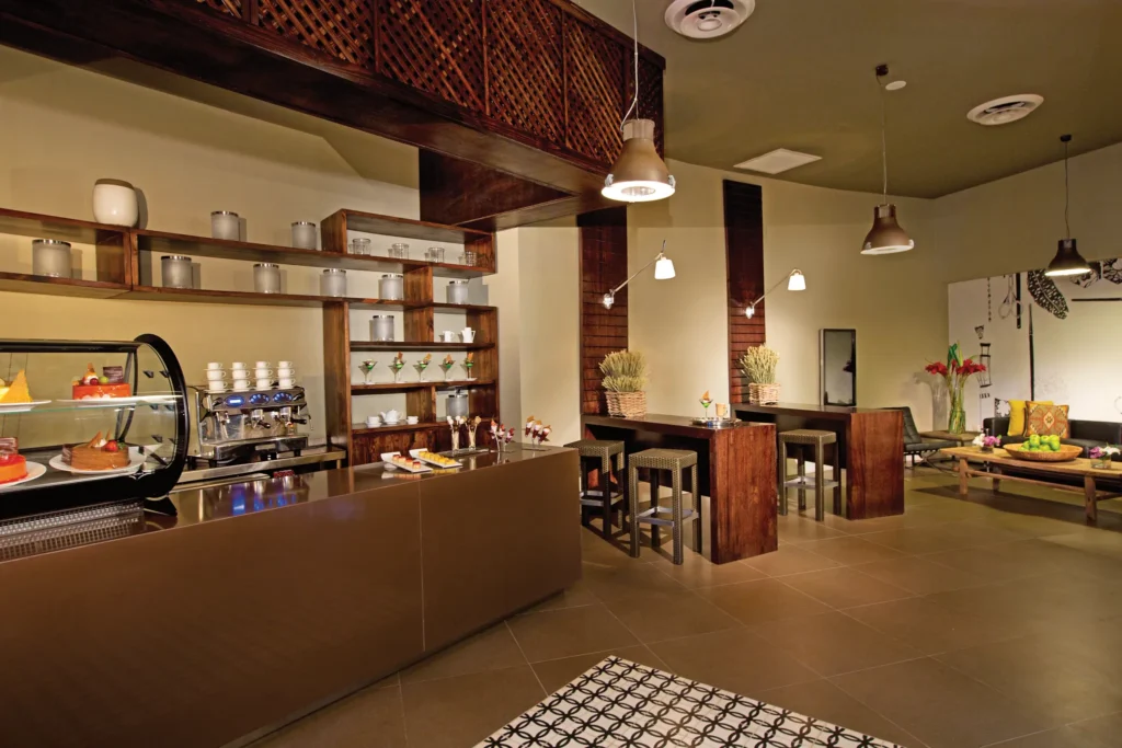 The Nook Café at Breathless Punta Cana featuring a modern coffee bar, fresh pastries, and a relaxed casual café atmosphere.