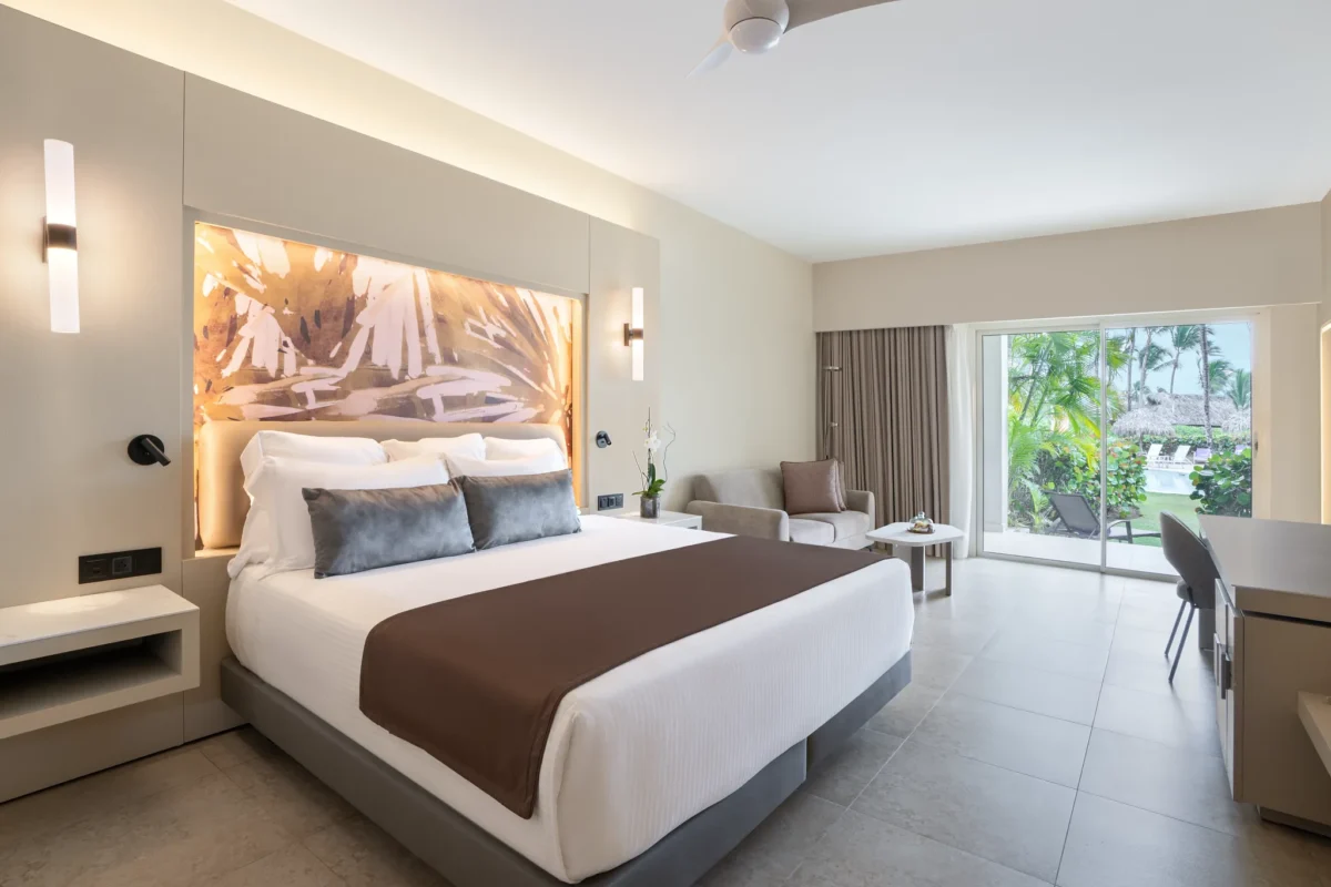 Xhale Club Junior Suite Pool View with king bed and private terrace overlooking the pool at Breathless Punta Cana Resort.