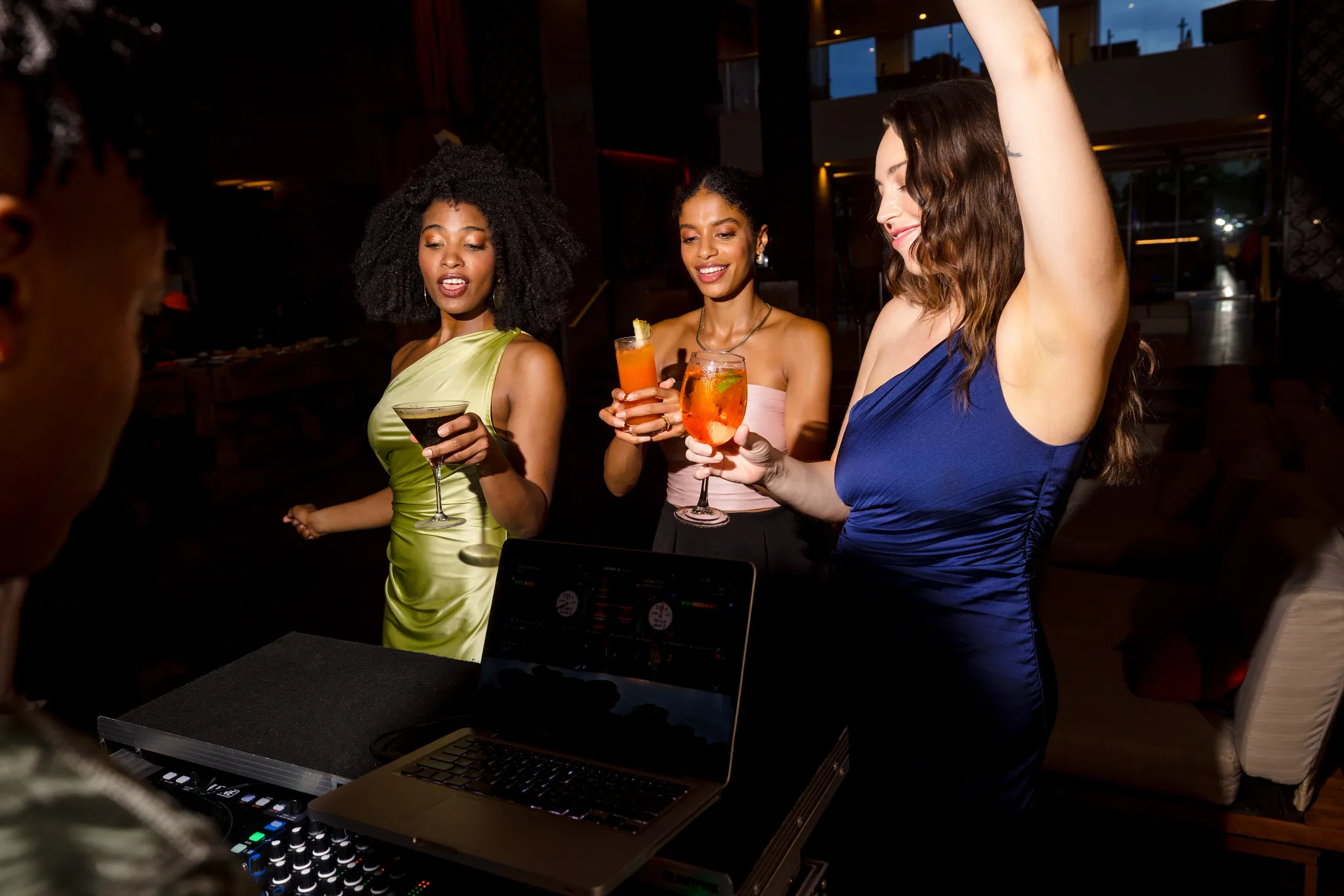 Guests dancing and enjoying drinks during a DJ-led nightlife event at Breathless Montego Bay.