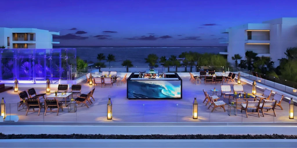 Purple Rooftop lounge wedding reception at Breathless Riviera Cancun at night