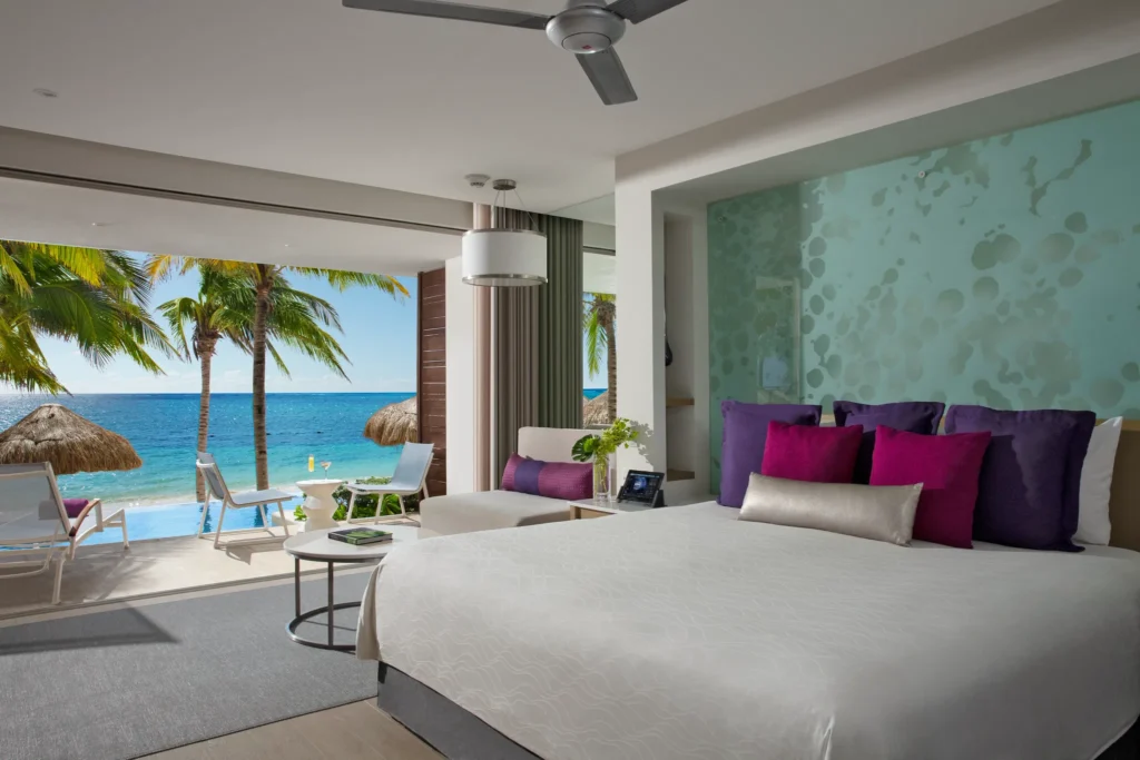 Private swim-out terrace with infinity pool and ocean view from the Xhale Club Junior Suite Swim Out Ocean Front at Breathless Riviera Cancun.