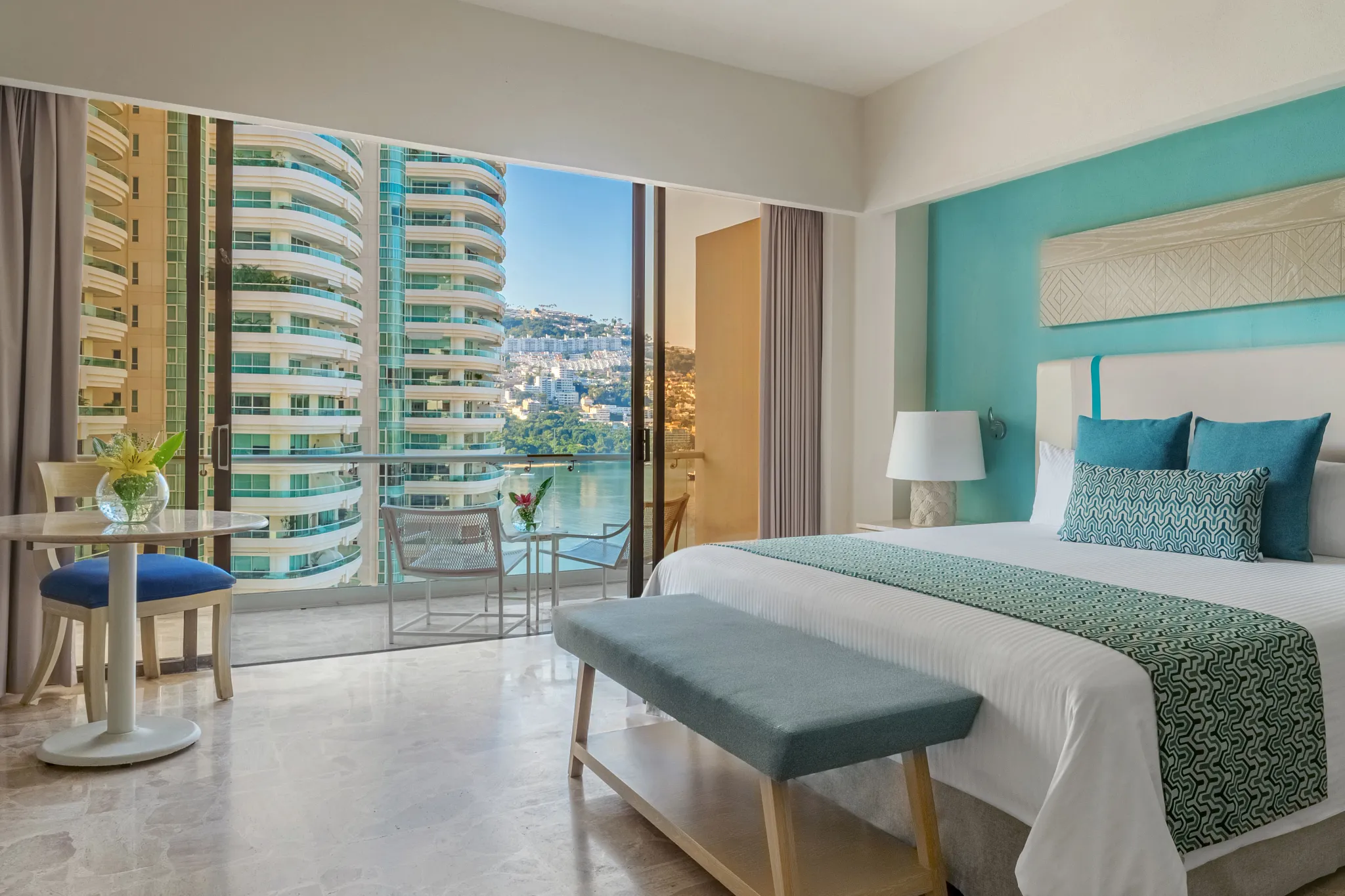 Deluxe Tropical View room with king bed and private balcony at Dreams Acapulco Resort & Spa.