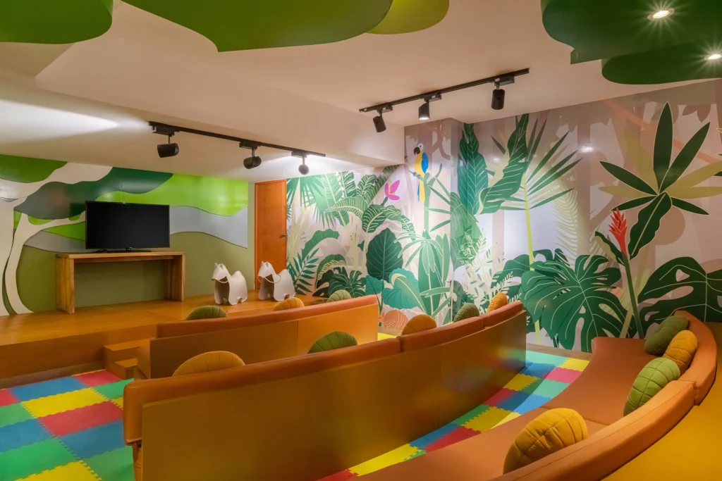 Children’s theater room with seating and jungle-themed decor at Dreams Acapulco Resort & Spa.