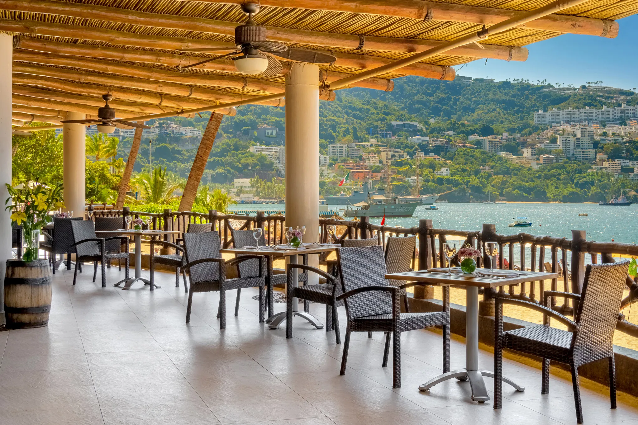 El Pescador Seafood Restaurant and Steakhouse at Dreams Acapulco Resort & Spa featuring oceanfront terrace dining with views of Acapulco Bay.