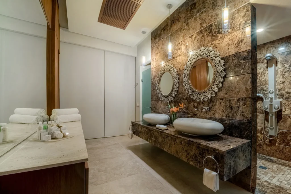 Preferred Club Presidential Three-Bedroom Ocean Front bathroom with marble finishes and dual sinks at Dreams Acapulco Resort & Spa.