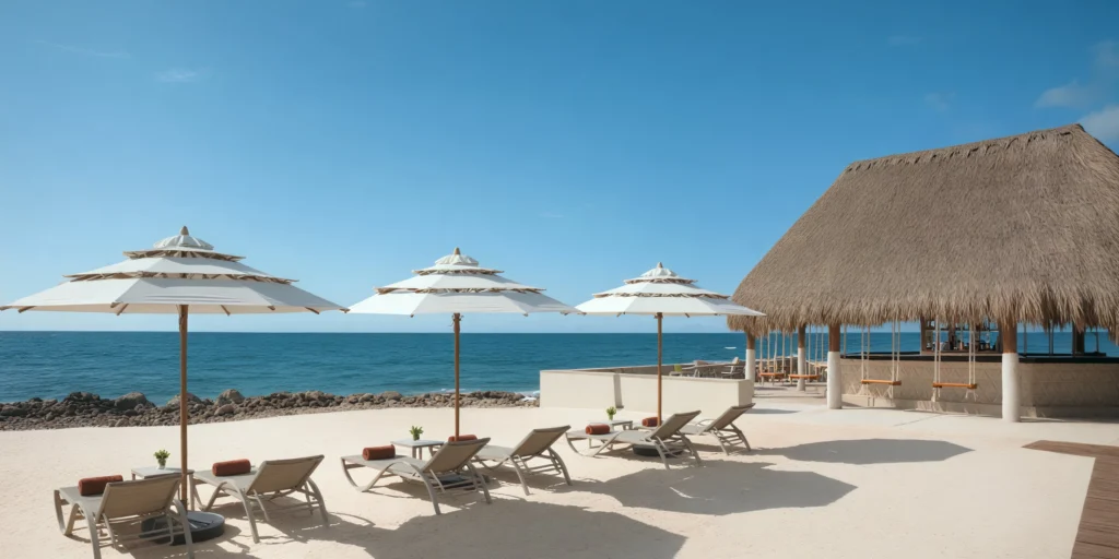 Beachfront lounge chairs and umbrellas at Barracuda Bar Venue Dreams Aventuras Riviera Maya