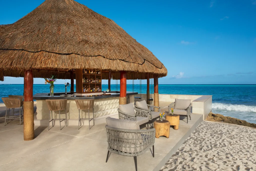 Barracuda beachfront restaurant at Dreams Aventuras Riviera Maya featuring open-air dining, ocean views, and a relaxed tropical atmosphere.