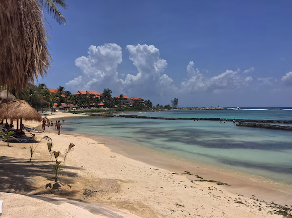 Oasis Beach near Dreams Aventuras Riviera Maya with soft sand, clear turquoise waters, and relaxing coastal views