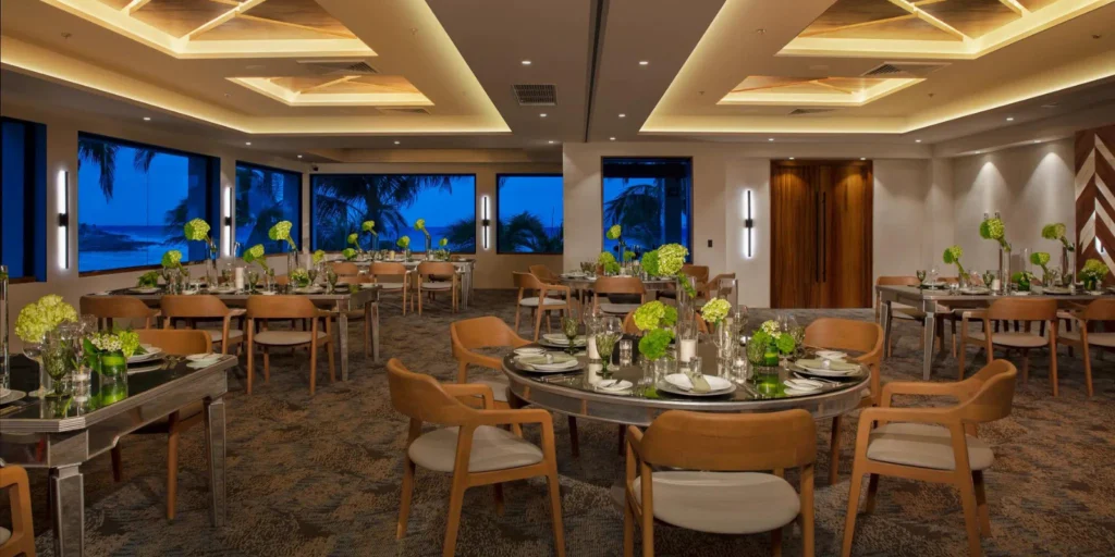 Playa Ballroom reception setup with round tables at Dreams Aventuras Riviera Maya