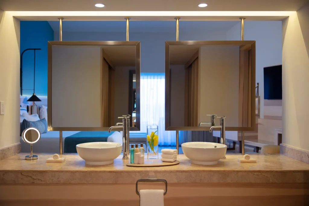 Preferred Club Family Room bathroom with double sinks and modern vanity at Dreams Aventuras Riviera Maya.