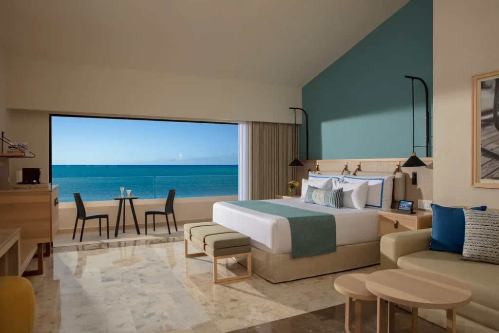 Preferred Club Ocean Front room with king bed and panoramic Caribbean ocean view at Dreams Aventuras Riviera Maya.