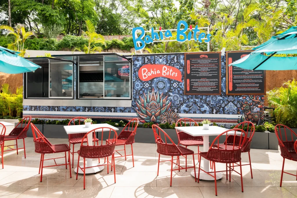 Bahia Bites snack bar at Dreams Bahia Mita Surf & Spa Resort featuring casual beachfront dining, light bites, and relaxed open-air seating.