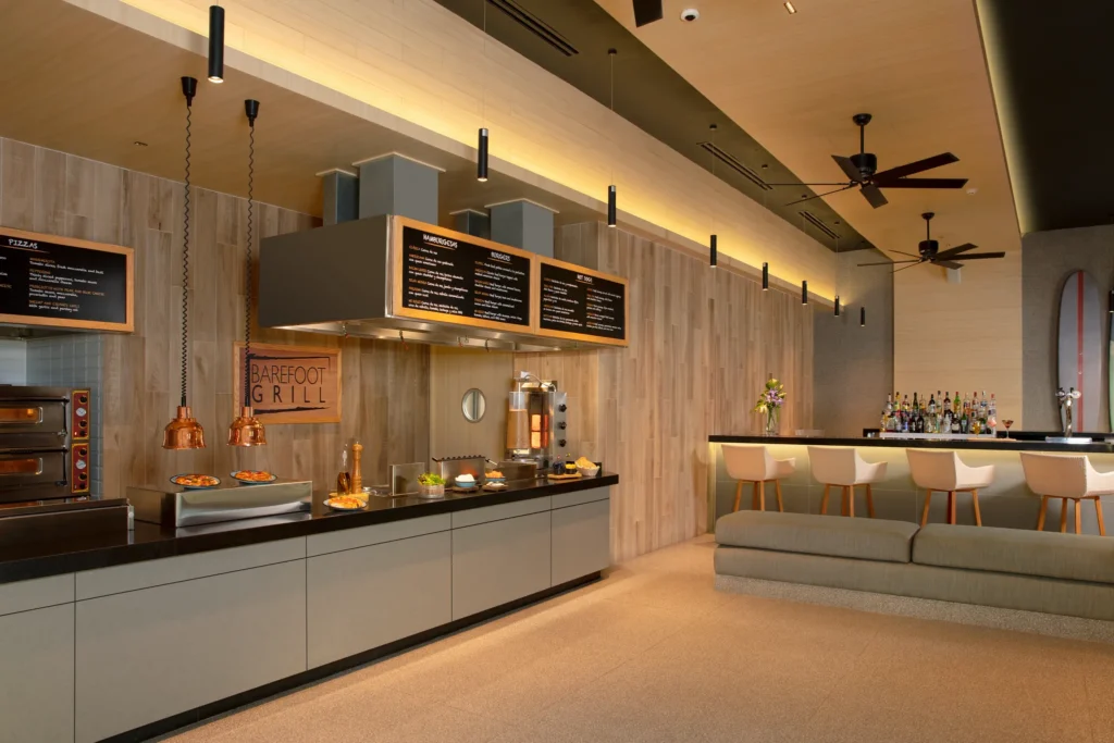 Barefoot Grill at Dreams Bahia Mita Surf & Spa Resort featuring casual poolside dining, grilled favorites, and relaxed outdoor seating near the beach.