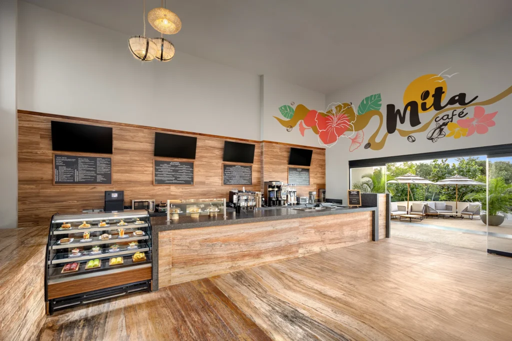 Café Mita at Dreams Bahia Mita Surf & Spa Resort featuring a cozy coffee shop atmosphere, fresh pastries, and specialty coffee drinks.