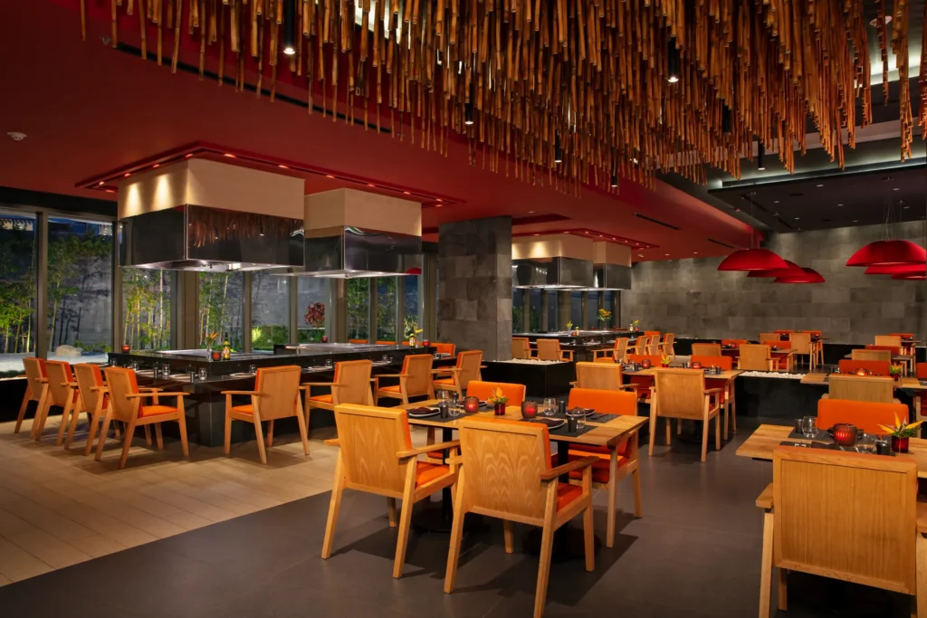 Himitsu restaurant at Dreams Bahia Mita Surf & Spa Resort featuring Asian fusion cuisine, teppanyaki tables, and an elegant, modern dining atmosphere.