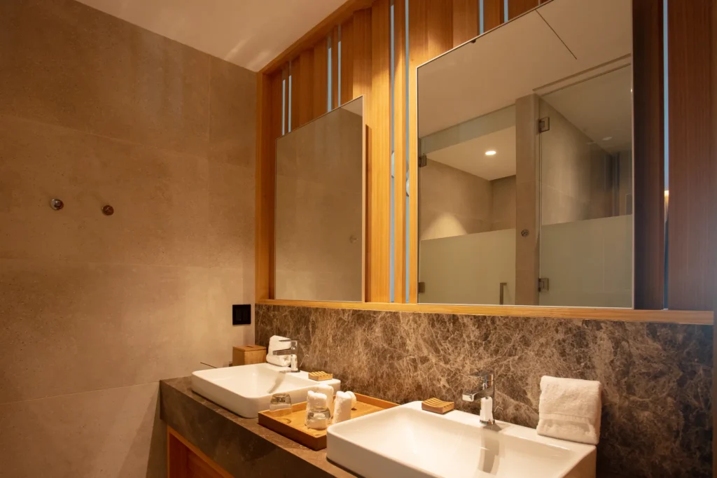 Junior Suite Ocean Front bathroom with double vanity sinks and modern finishes at Dreams Bahia Mita Surf & Spa Resort.