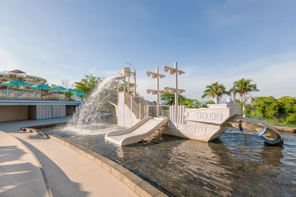 Children’s pool with pirate ship play structure and water features at Dreams Bahia Mita.
