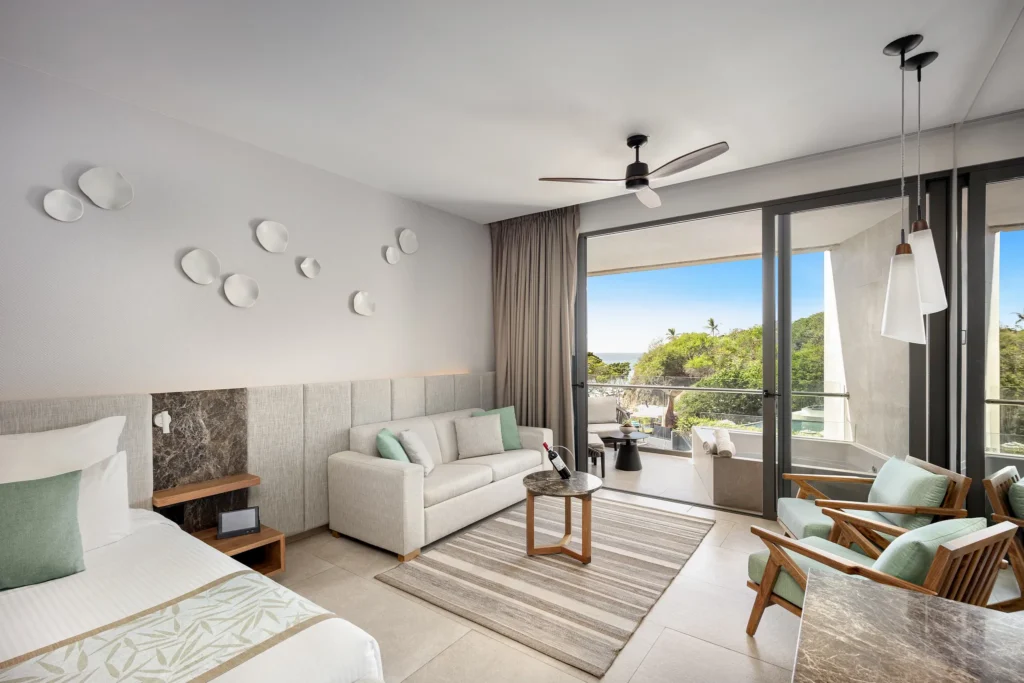 Preferred Club Family Suite Panoramic View with seating area and terrace with outdoor soaking tub at Dreams Bahia Mita Resort.