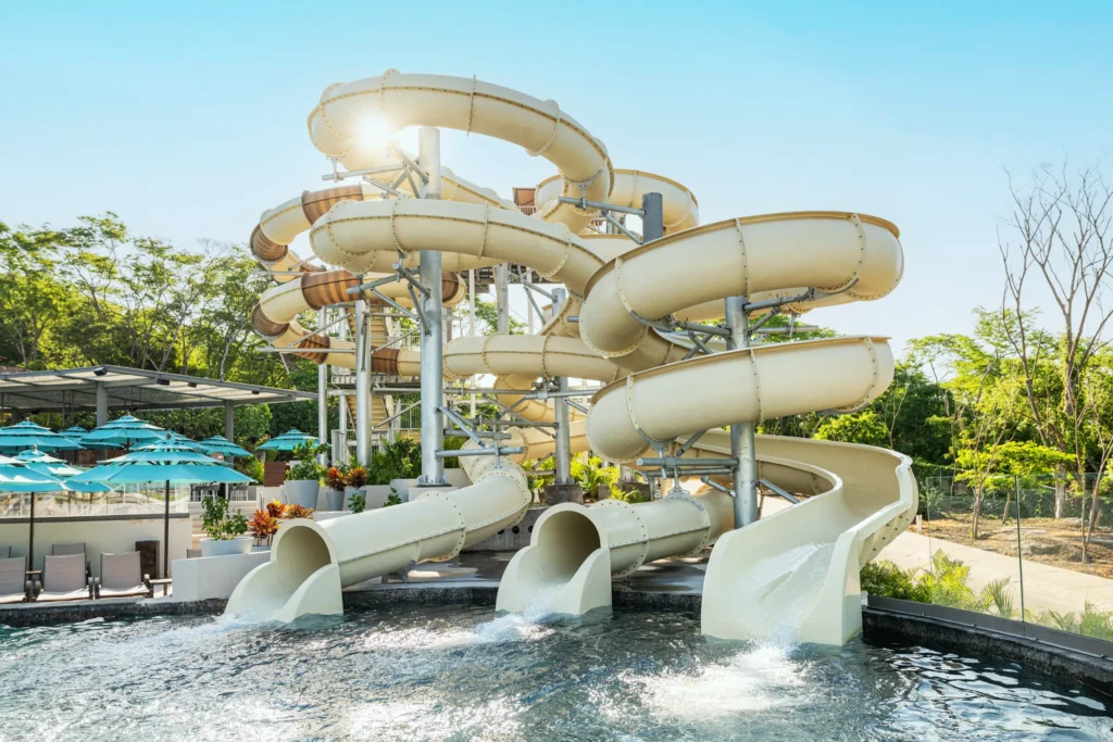 Large twisting water slides at the Dreams Bahia Mita resort water park.